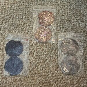 Three sets of purple car coasters